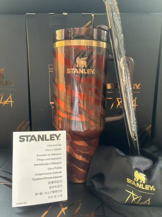 Stanley brown copper patterned insulated tumbler with handle and straw